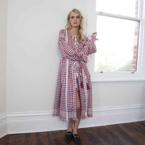 red keffiyeh dress KEFFIYEH DOLLS DRESS / Pink with Poppy red ., ., the return of the original keffiyeh dolls dress in a new summer colourway., lightweight cotton with signature keffiyeh-inspired detailing and an