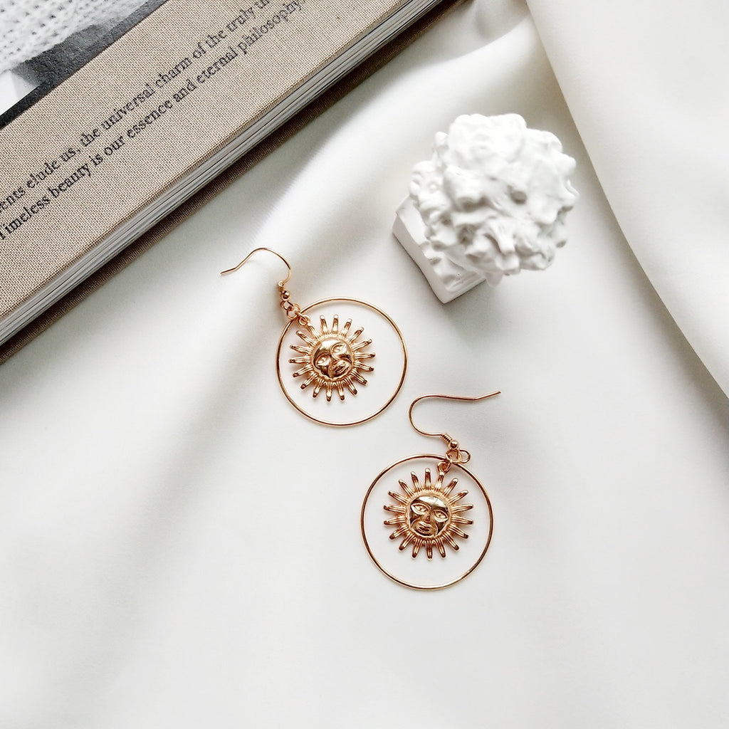 Sun shop face earrings